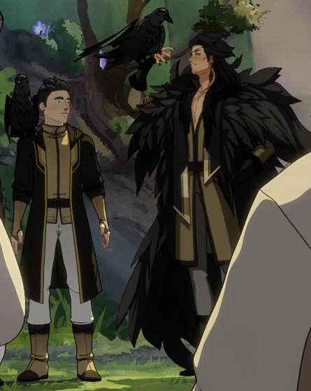 Two persons dressed in similar outfits are standing in front of some boulders and green bushes/trees. The smaller one has a crow on their shoulder, the taller one has one crow sitting on their hand, lifted up to the sky.
